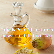 Load image into Gallery viewer, Truth Cosmetics bakuchiol and rose geranium facial oil in a glass bottle on a wooden table