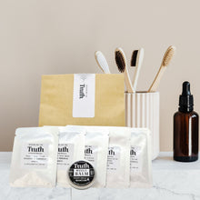 Load image into Gallery viewer, Truth Cosmetics sample sachets balm tin and dropper bottle displayed as high quality skincare free trial kit