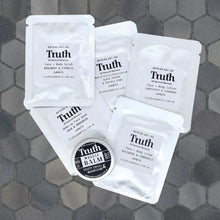 Load image into Gallery viewer, Truth Cosmetics vegan skincare sample pack of sachets and small balm tin on gray hex tile background