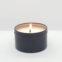 Load image into Gallery viewer, Australian bush vegan candle in matte black tin with single lit wick on white background
