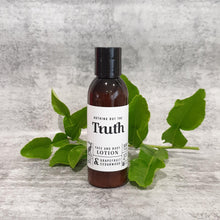 Load image into Gallery viewer, Truth Cosmetics vegan face and body lotion with grapefruit and cedarwood in brown bottle