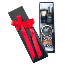 Load image into Gallery viewer, Truth Cosmetics vegan shave gift set in black gift box with red ribbon containing shaving brush soap tin serum and bar soap