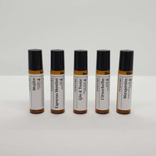 Load image into Gallery viewer, Truth Cosmetics1 natural vegan essential oil perfume roll on five amber bottles labeled Mojito Espresso Martini Gin Tonic