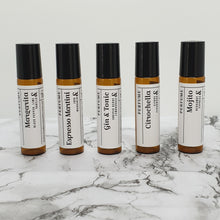 Load image into Gallery viewer, Truth Cosmetics1 natural vegan essential oil perfume five amber roller bottles with black caps on marble