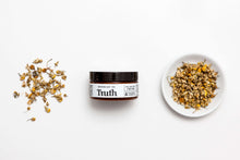 Load image into Gallery viewer, Truth Cosmetics jar of rosewood chamomile moisturizer for sensitive skin with chamomile buds and bowl