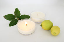 Load image into Gallery viewer, Truth Cosmetics display with citrus and candles showcasing vegan face and body wash and lotion set
