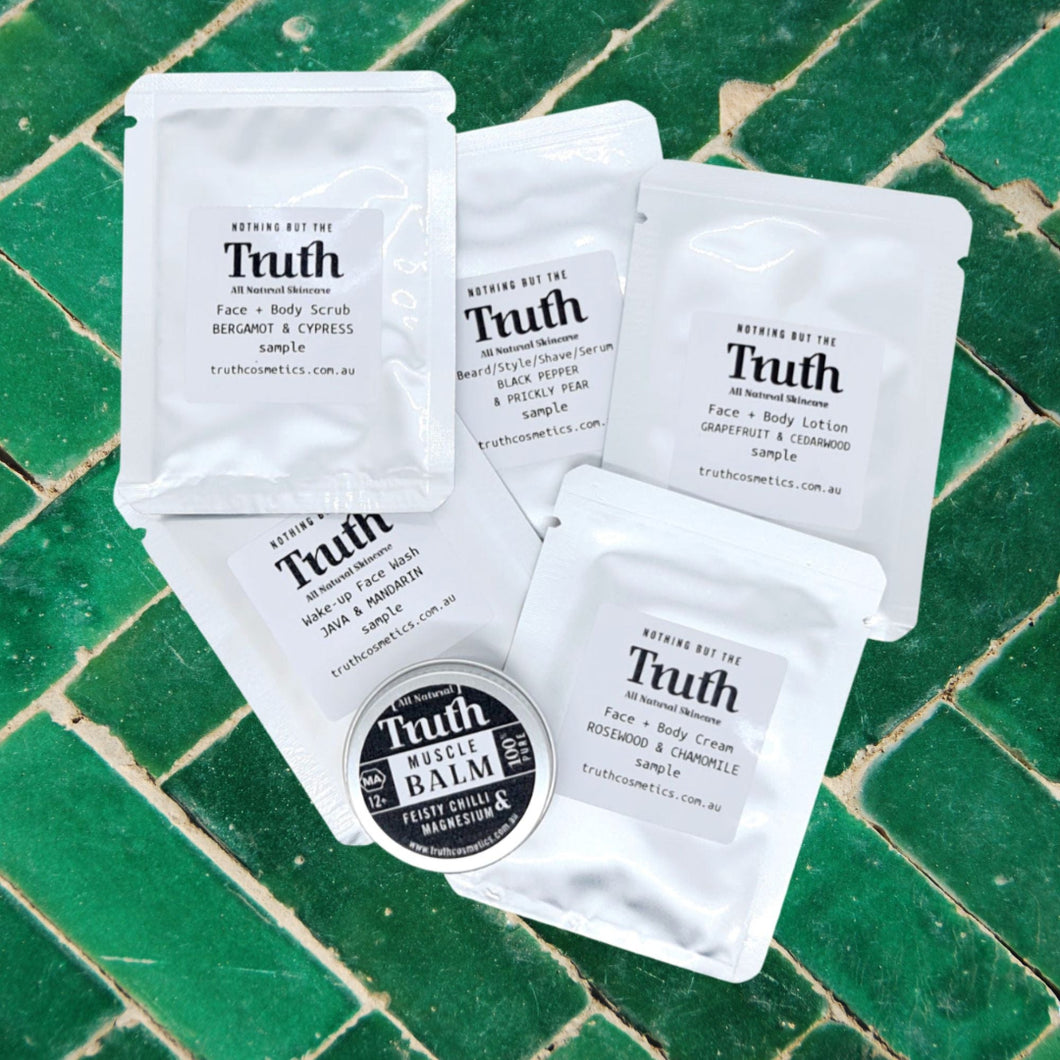 Truth Cosmetics sample sachets and small balm on green tiles hydrating face and body lotion with free sample
