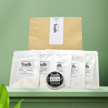 Load image into Gallery viewer, Truth Cosmetics vegan skincare sample pack with six sample sachets and small muscle balm tin on green backdrop
