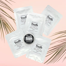 Load image into Gallery viewer, Truth Cosmetics1 sample sachets and balm on pink background showing vegan skincare sample pack for travel and trial
