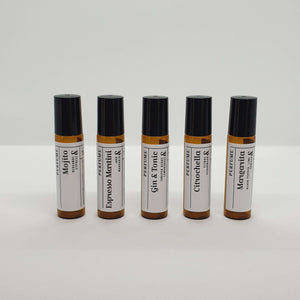 Truth Cosmetics1 natural vegan essential oil perfume roll on five amber bottles labeled Mojito Espresso Martini Gin Tonic