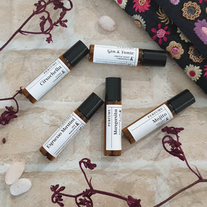 Truth Cosmetics perfume roller bottles on stone with embroidered cloth and dried florals cruelty free beauty gift card