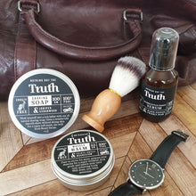 Load image into Gallery viewer, Truth Cosmetics grooming set with shaving soap brush balm and serum beside leather bag and watch cruelty free beauty gift card
