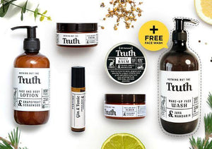 Truth Cosmetics assortment of jars and bottles including face wash lotion balm and scrub in a complete natural skincare kit